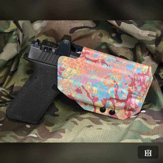 Pastel splatter-print OWB holster with pistol and red dot sight